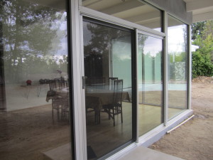 Clear Anodized Retractable Screen Door for a sliding screen door