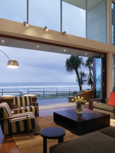 Sunrise view of wall screens for Bi-folding doors overlooking the ocea