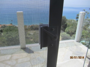 View from Living Room of Sliding Patio Screen Door Extruded Aluminum White Handle installed in Malibu Oceanview Home
