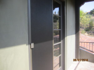 After view installation of custom made heavy duty sliding screen doors and sidelight panels with pet screen on double french doors in Topanga
