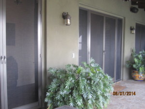 View after installation of custom made heavy duty vista 4500 screen doors and sidelight panels with pet screen on double french doors in Topanga
