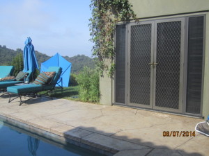 After view installation of custom made heavy duty security screen doors and sidelight panels with pet screen on double french doors in Topanga