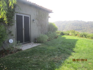 View after installation of custom made heavy duty Senry 4900 security screen doors on double french doors in Topanga