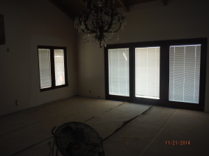 Custom painted and made Mahogany brown/brick retractable screen doors installed on double set sliding wood doors
